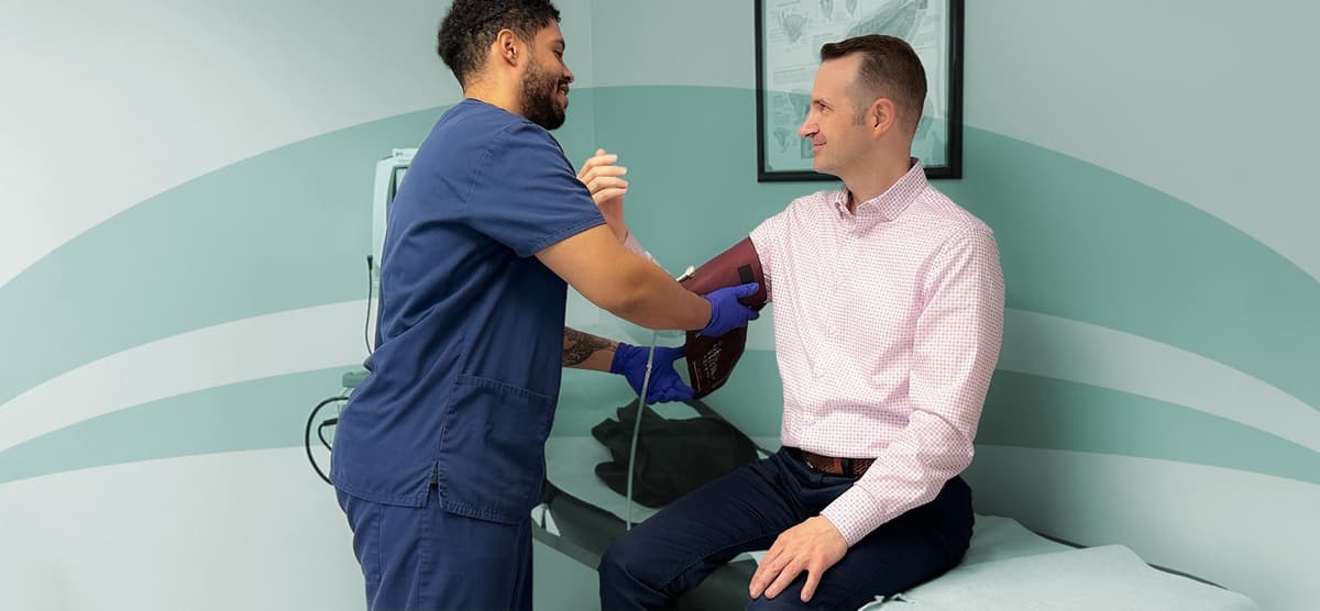 Aspire Health provider taking patient vitals during consultation