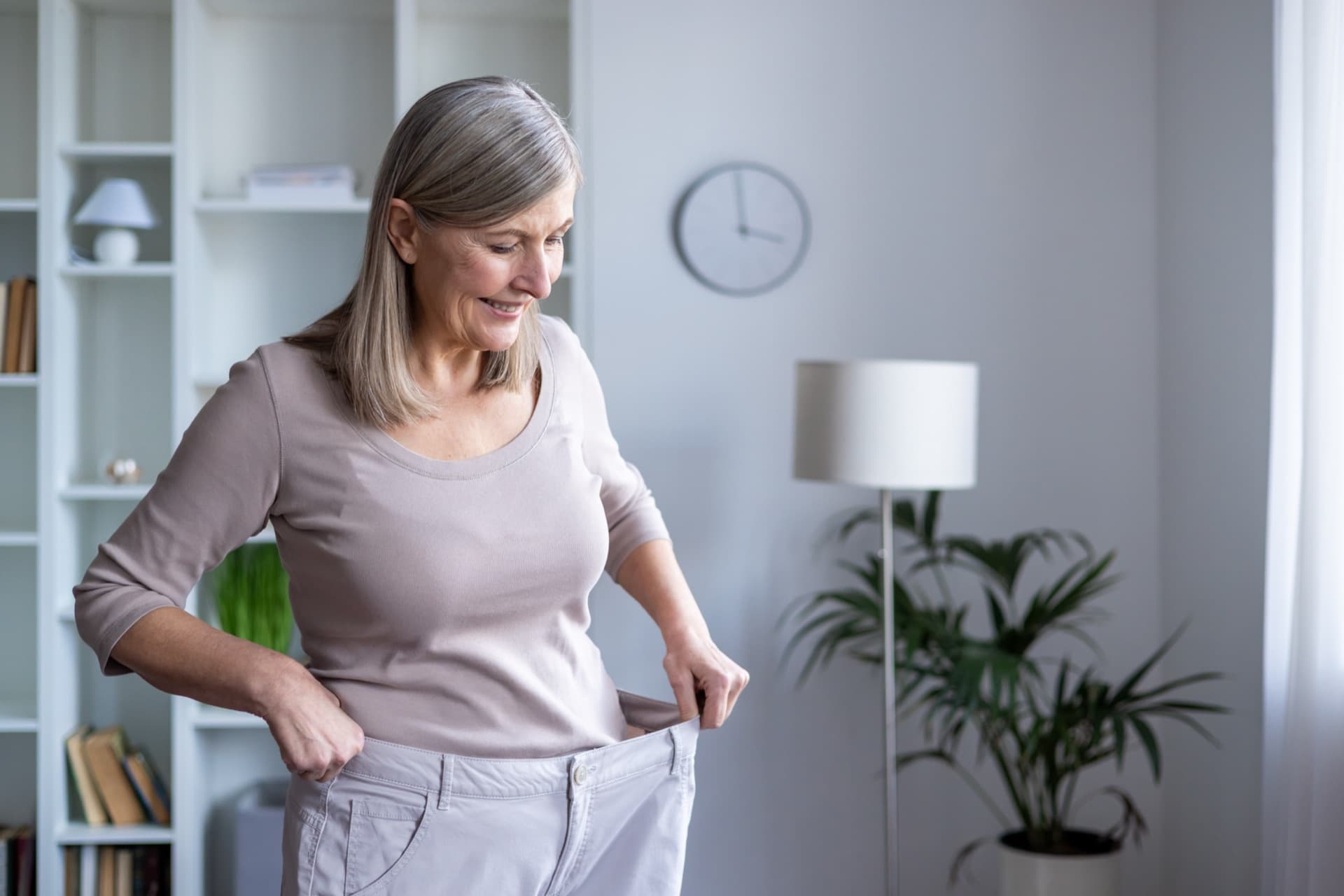 Patient celebrating medical weight-loss results at Aspire Health